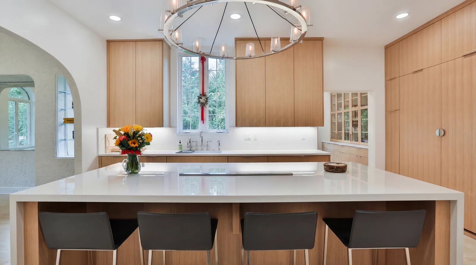 White oak kitchen with a quartz island in a 1928 Portland West Hills remodel by Eight Inch Nails Construction