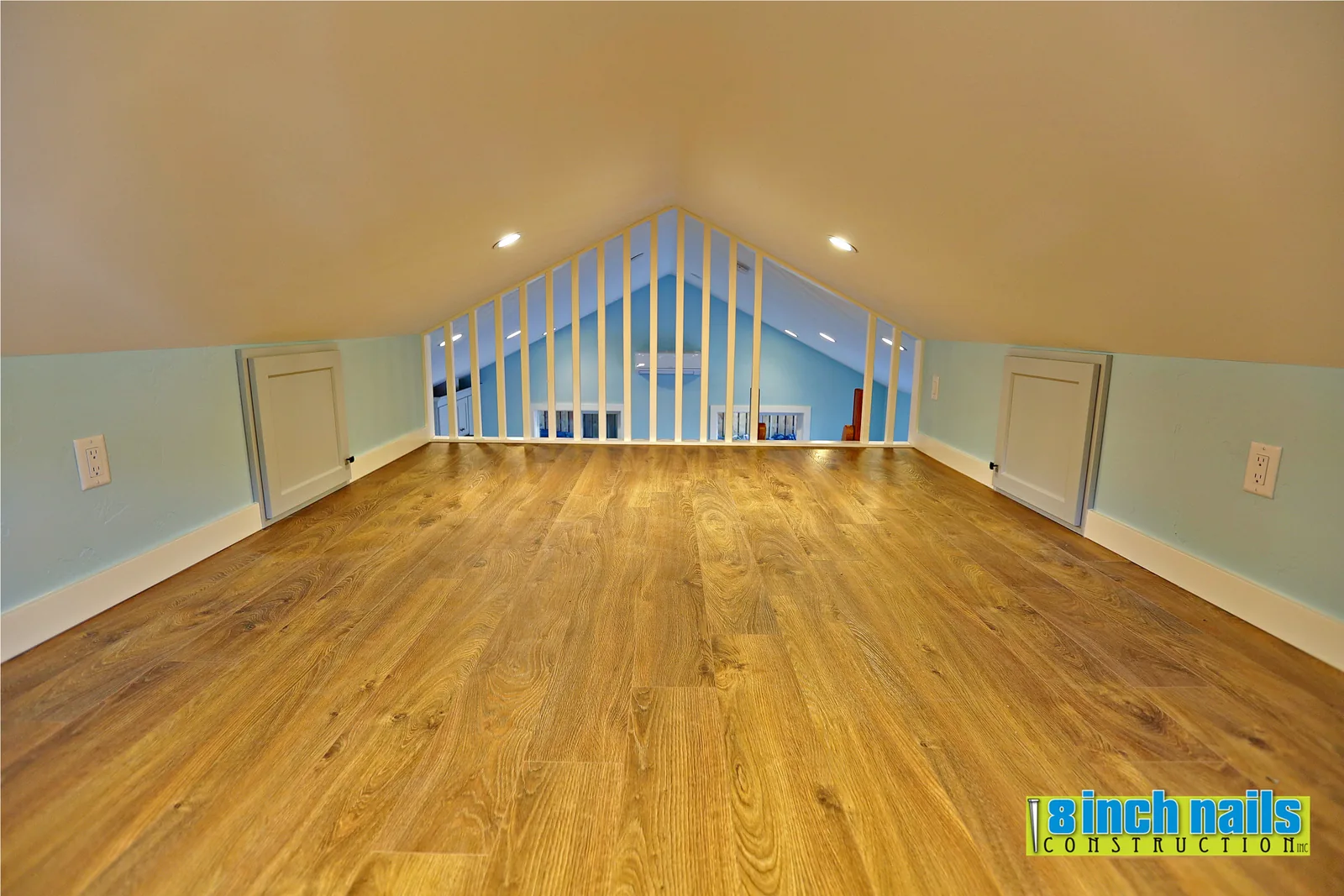 Knee-wall storage doors built into both sides of the ADU loft