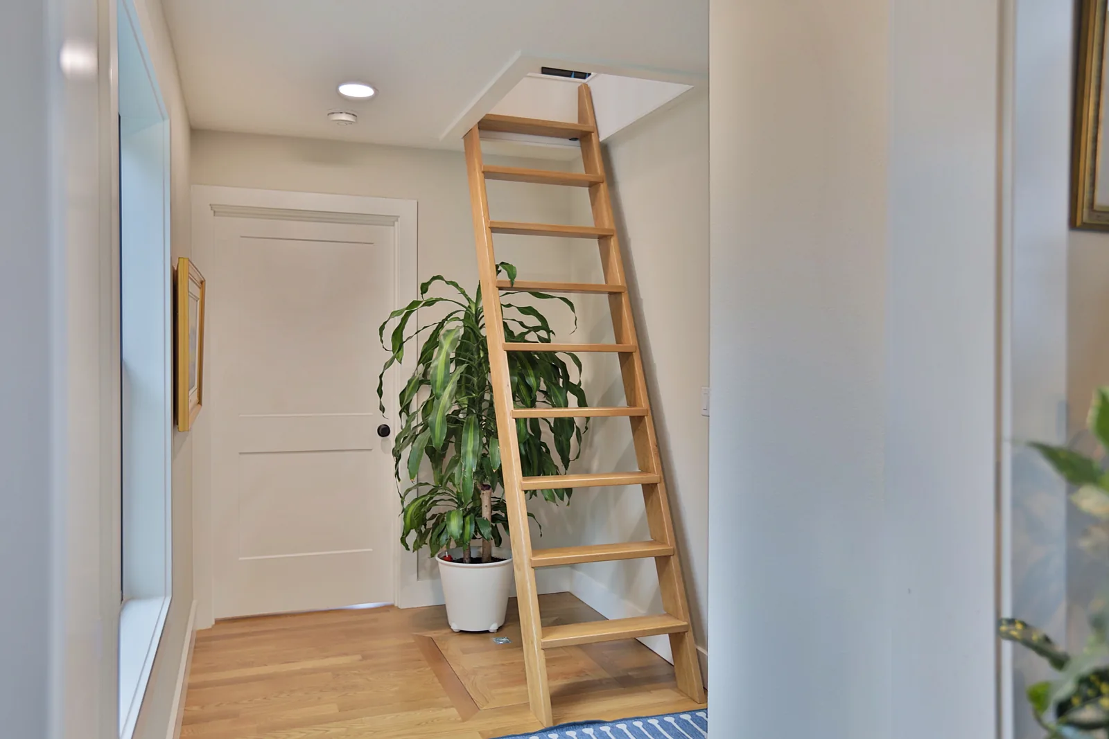 Wood ship's ladder up to the 373 sq ft storage loft